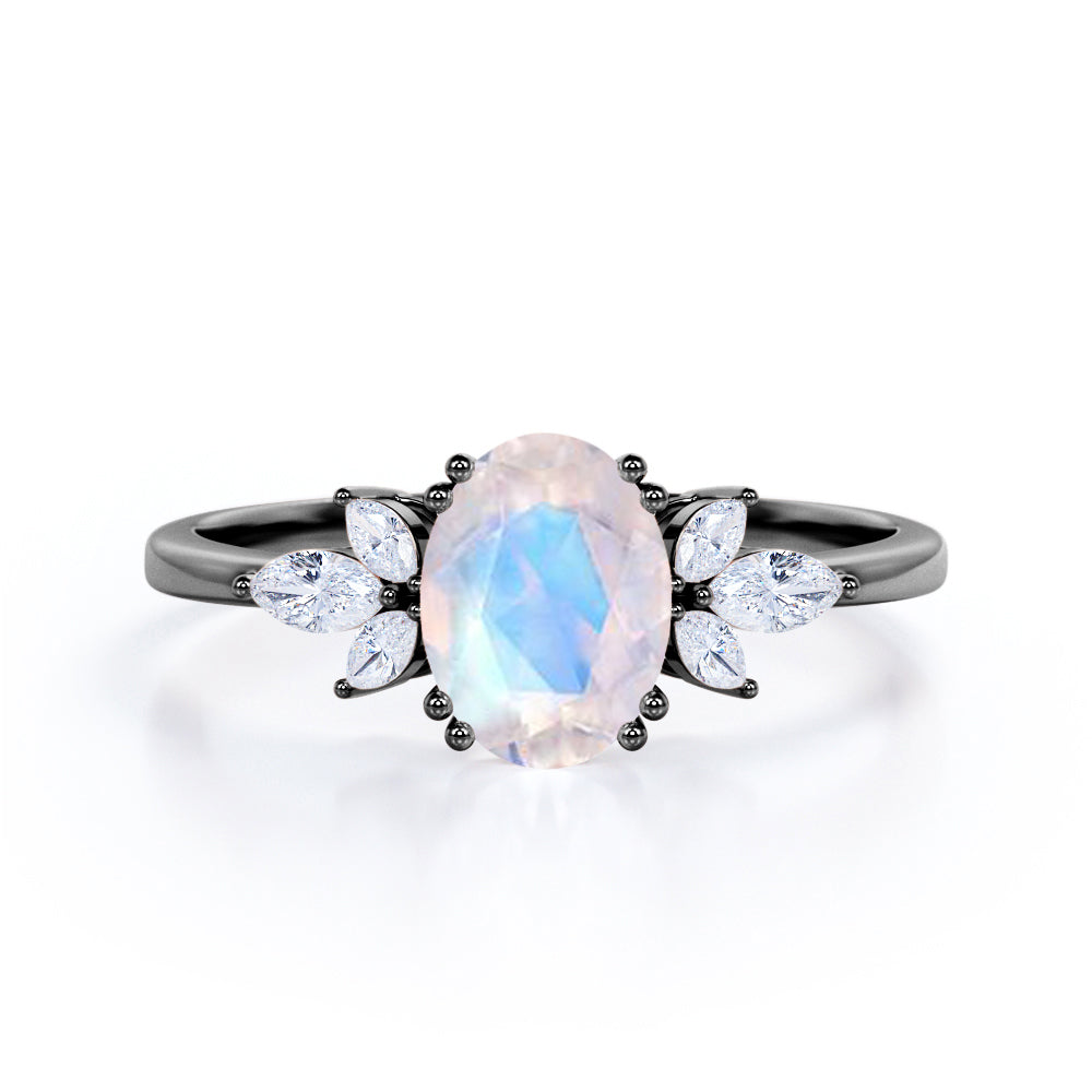 Floral inspired 1.25 carat Oval cut Rainbow Moonstone and marquise dia