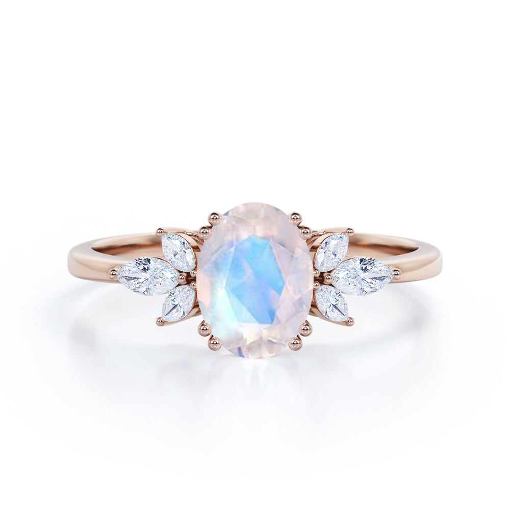 Floral inspired 1.25 carat Oval cut Rainbow Moonstone and marquise